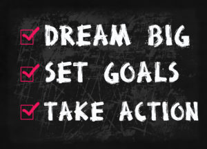 Dream big, set goal, take action word on blackboard